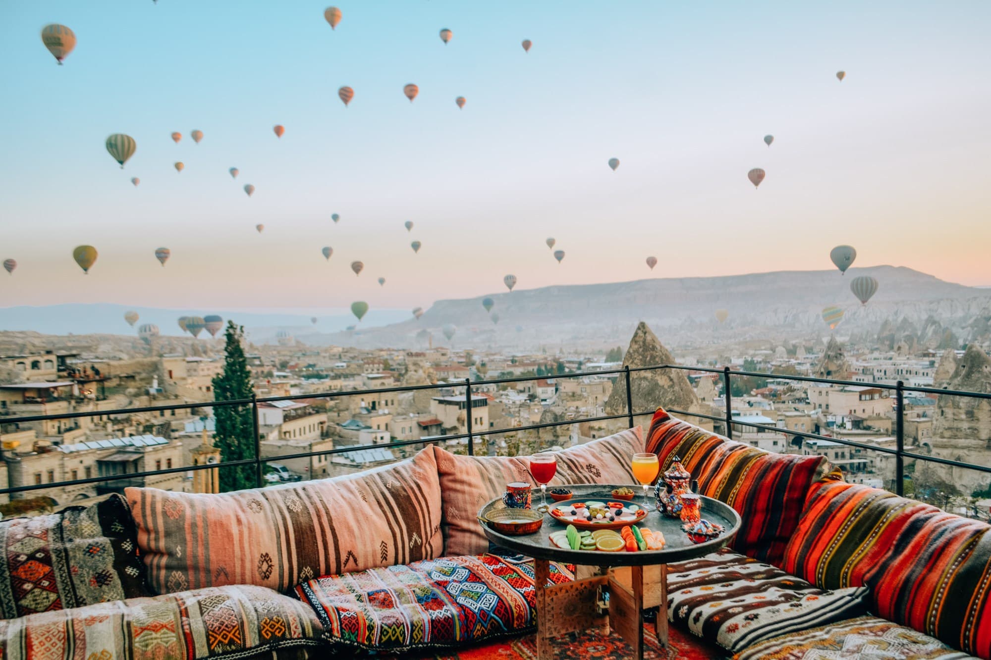 An Anatolian caravanserai with tall stone arches at golden hour.