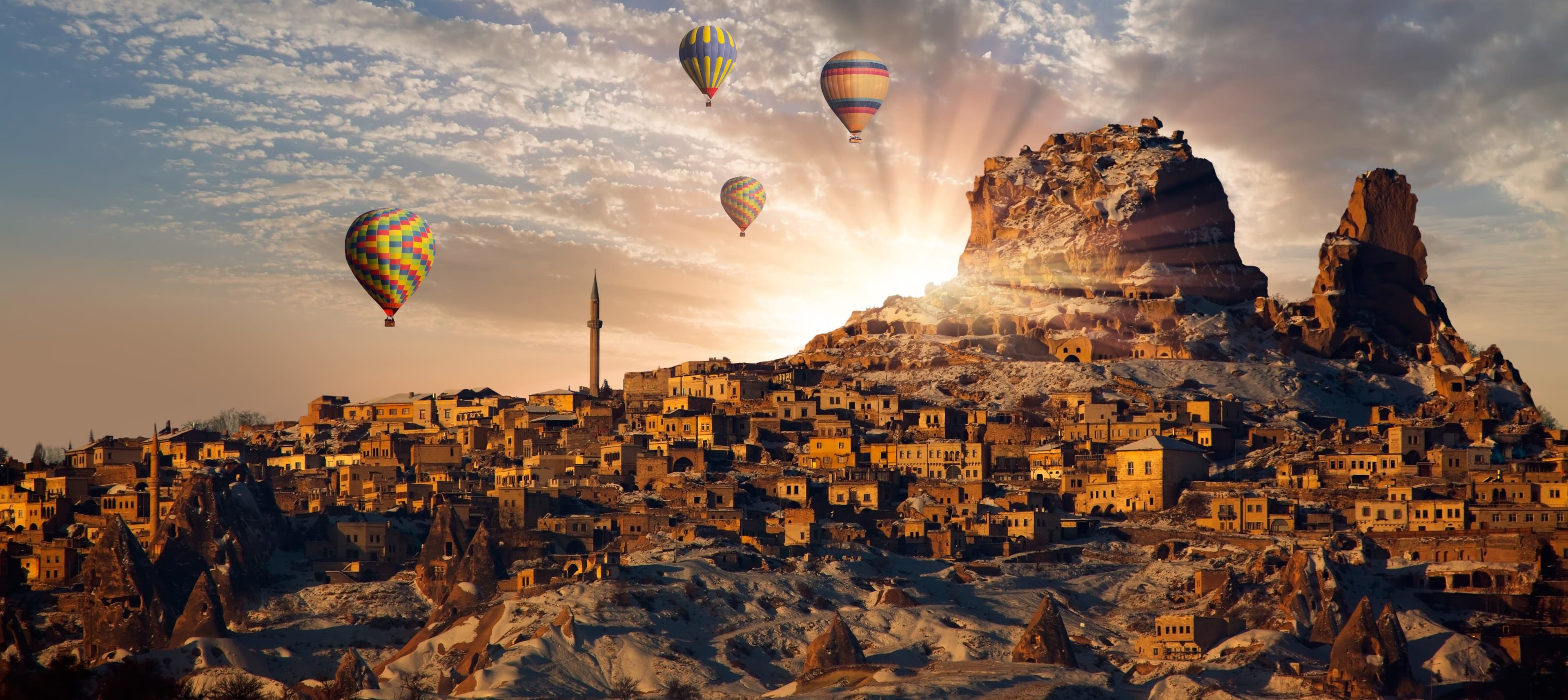 An Anatolian caravanserai with tall stone arches at golden hour.