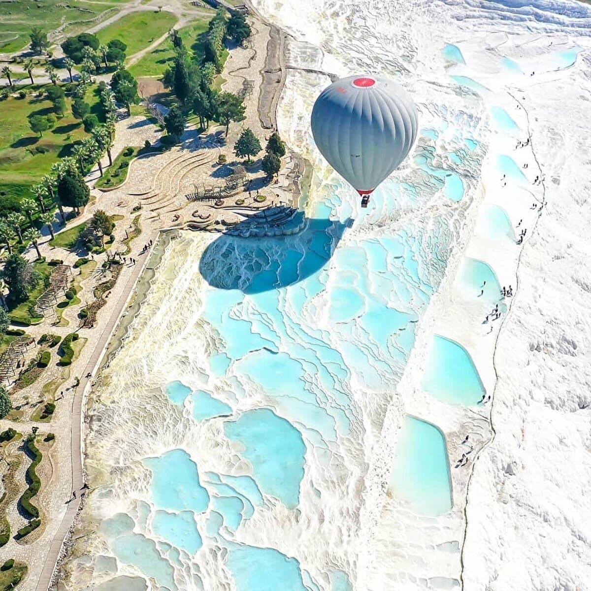 Pamukkale white travertine terraces under sunset — classic day tour highlight.