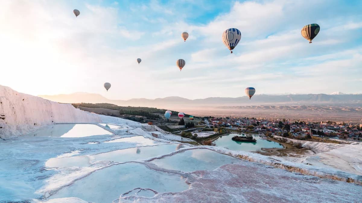 Pamukkale white travertine terraces under sunset — classic day tour highlight.