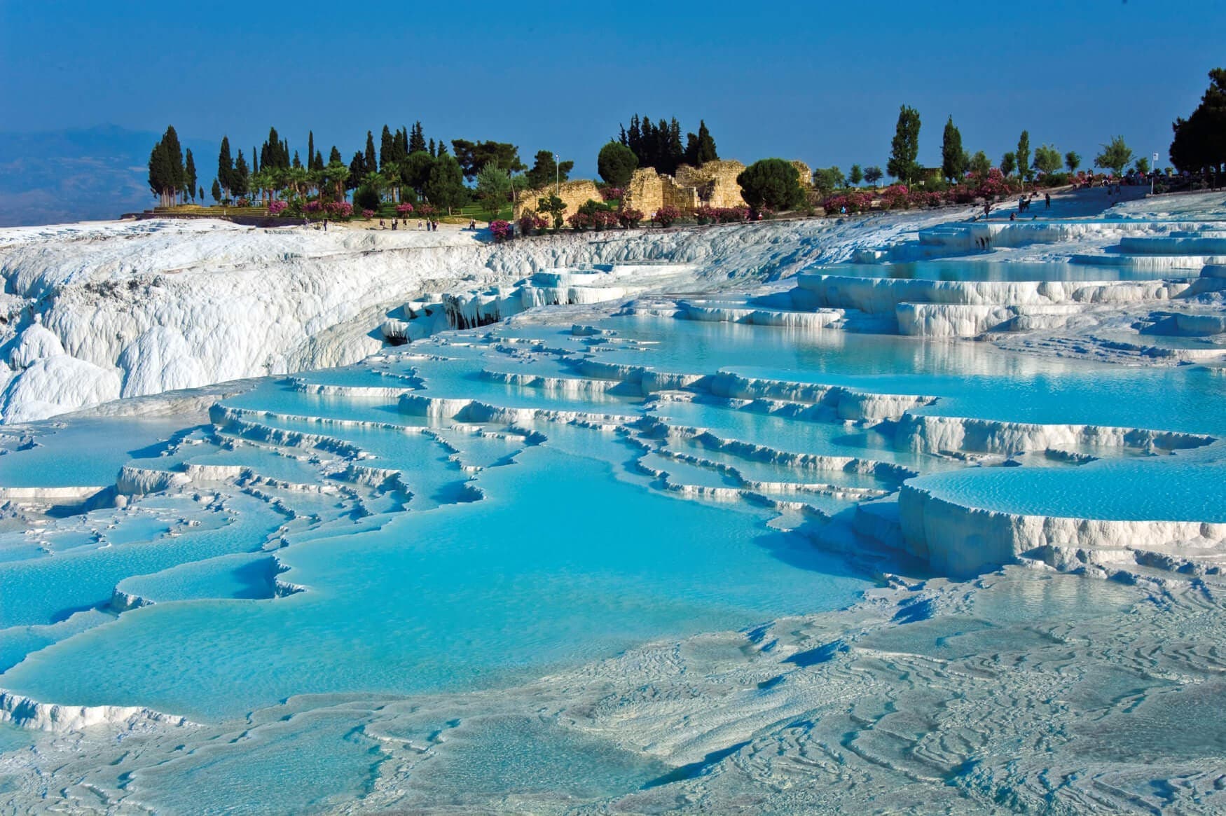 Pamukkale white travertine terraces under sunset — classic day tour highlight.