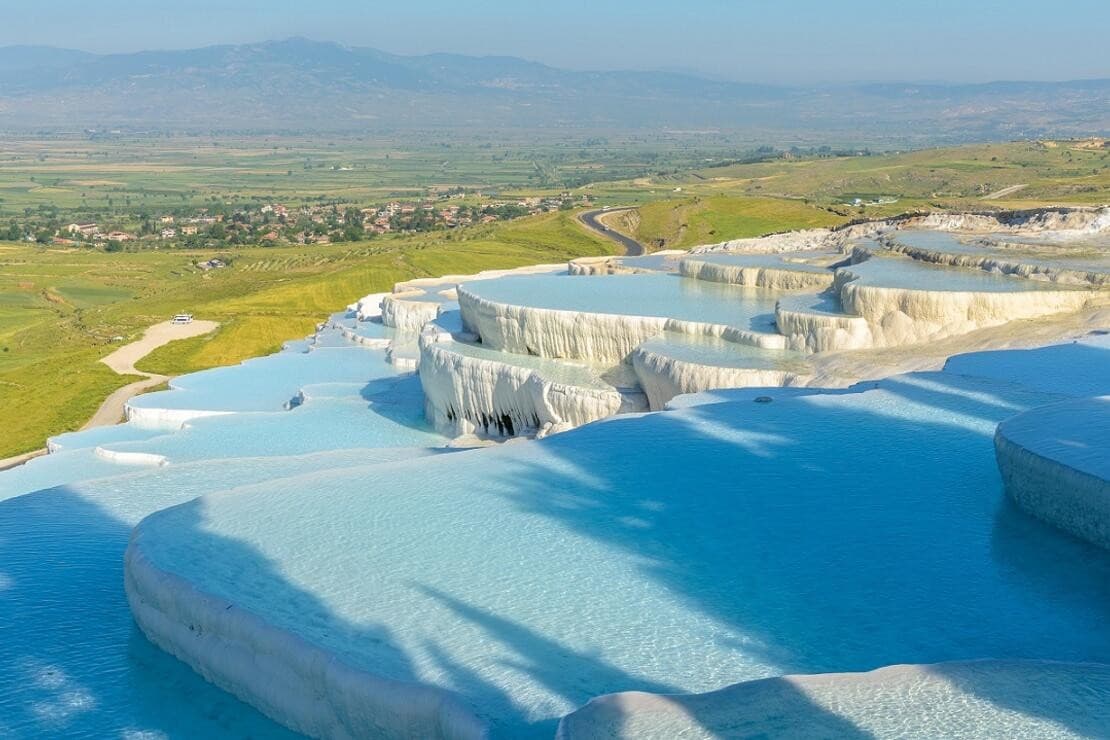 Pamukkale white travertine terraces under sunset — classic day tour highlight.
