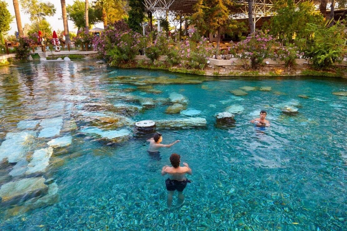 Pamukkale white travertine terraces under sunset — classic day tour highlight.