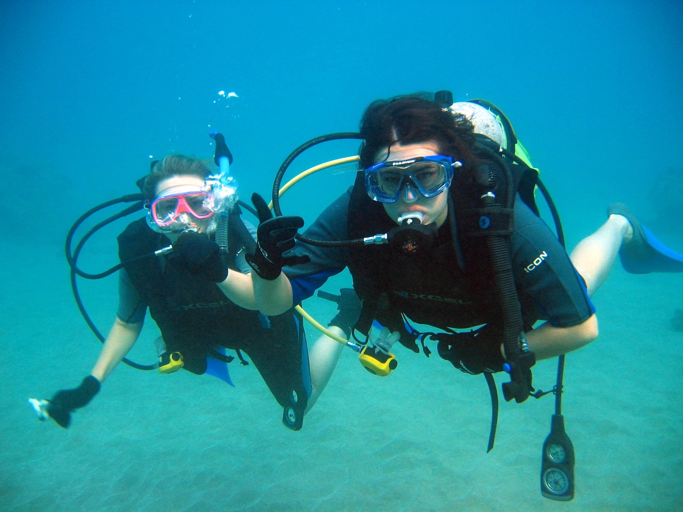 A scuba diver exploring the clear turquoise waters of an Aegean reef near Kusadasi.