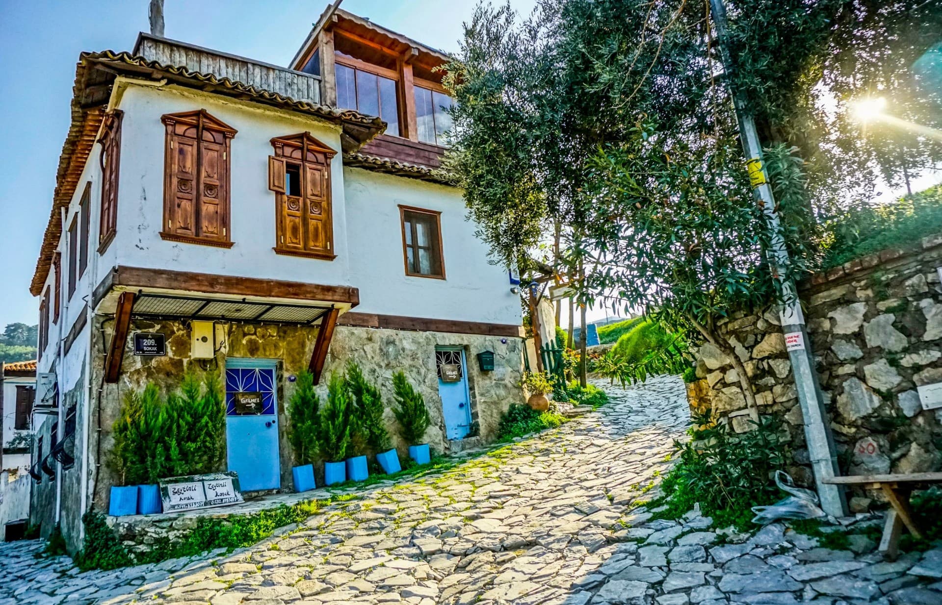 Stone houses of Sirince village with vineyards on the slopes.